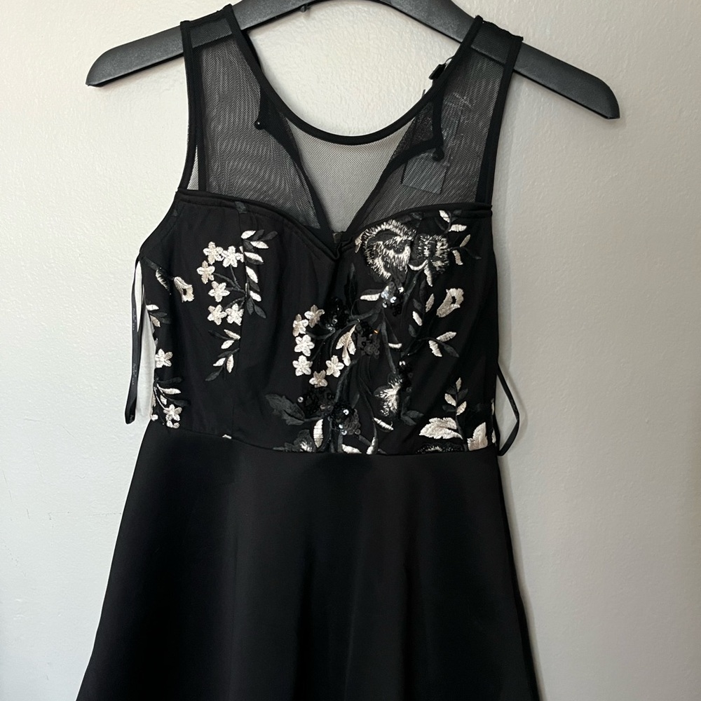 Cute black dress midi sheer fabric with embroidery on the bustier